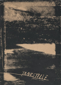 Book cover with roughly printed black textures over an unbleached paper cover. The title is written at the bottom: TANKSTELLE