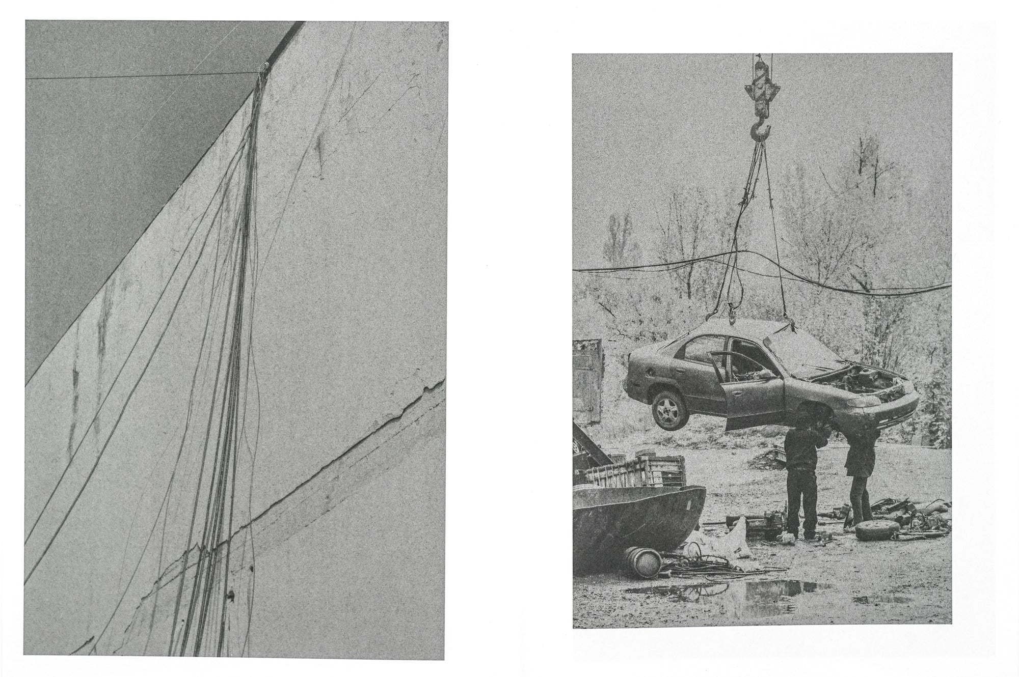 A spread showing two low-contrast black and white photographs, to the left one of wires hanging down a concrete wall and to the right a car held up by a crane with two people standing close by. 