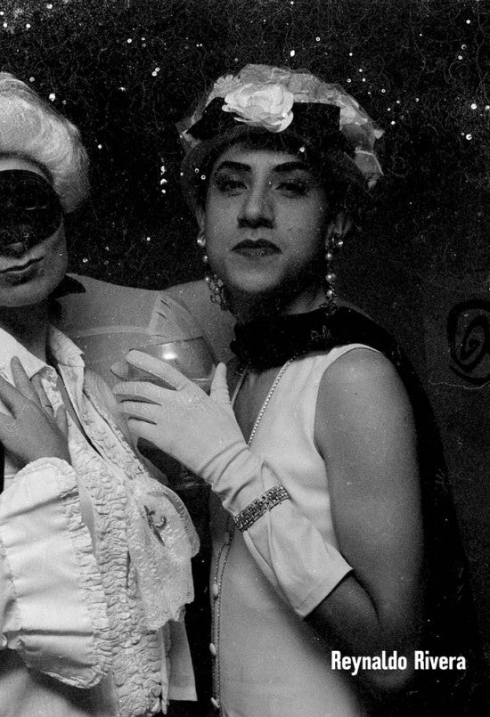 Reynaldo Rivera in sans serif type over a black an white image of someone in full dress and makeup