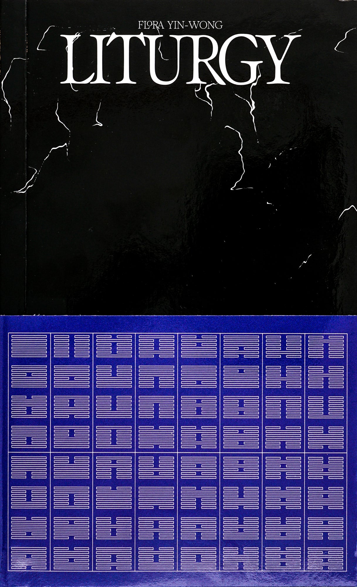 Book Cover with the upper half in monochrome black with white cracks and the title Liturgy in white serif writing. Above it the author Flore Yin-Wong in small white serif writing. The lower half of the page is covered in a Yves Klein Blue abstract grid consisting of lines, dots, boxes.