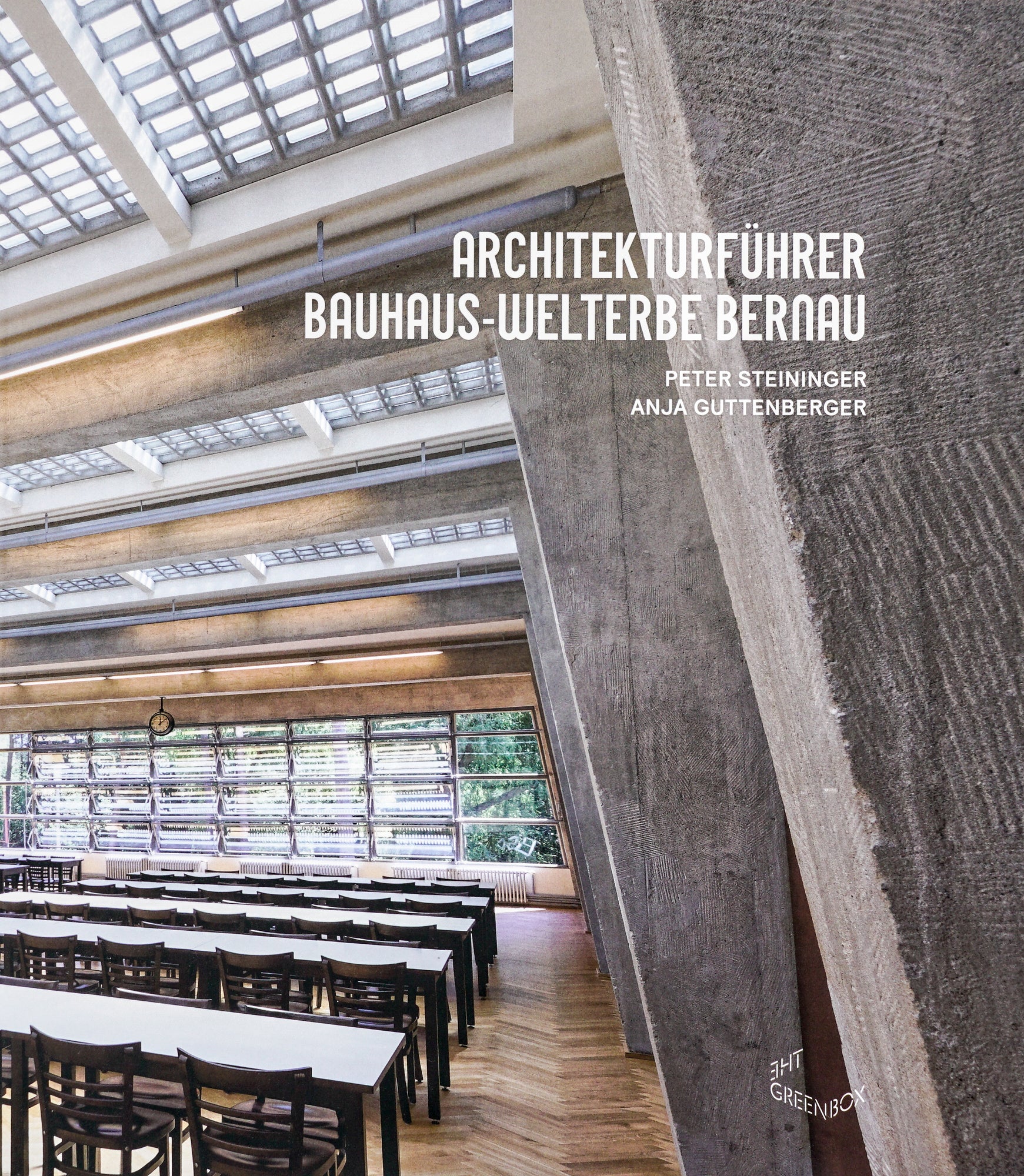 Book cover with a colour photography image of the inside of an architectural hall, depicting its beams, the ceiling and row of tables and chairs. The title Architekturführer. Bauhaus-Welterbe Bernau and the Editors is in white sans serif and the editors Peter Steininger and Anja Guttenberger below the title is as well in white sans serif writing.