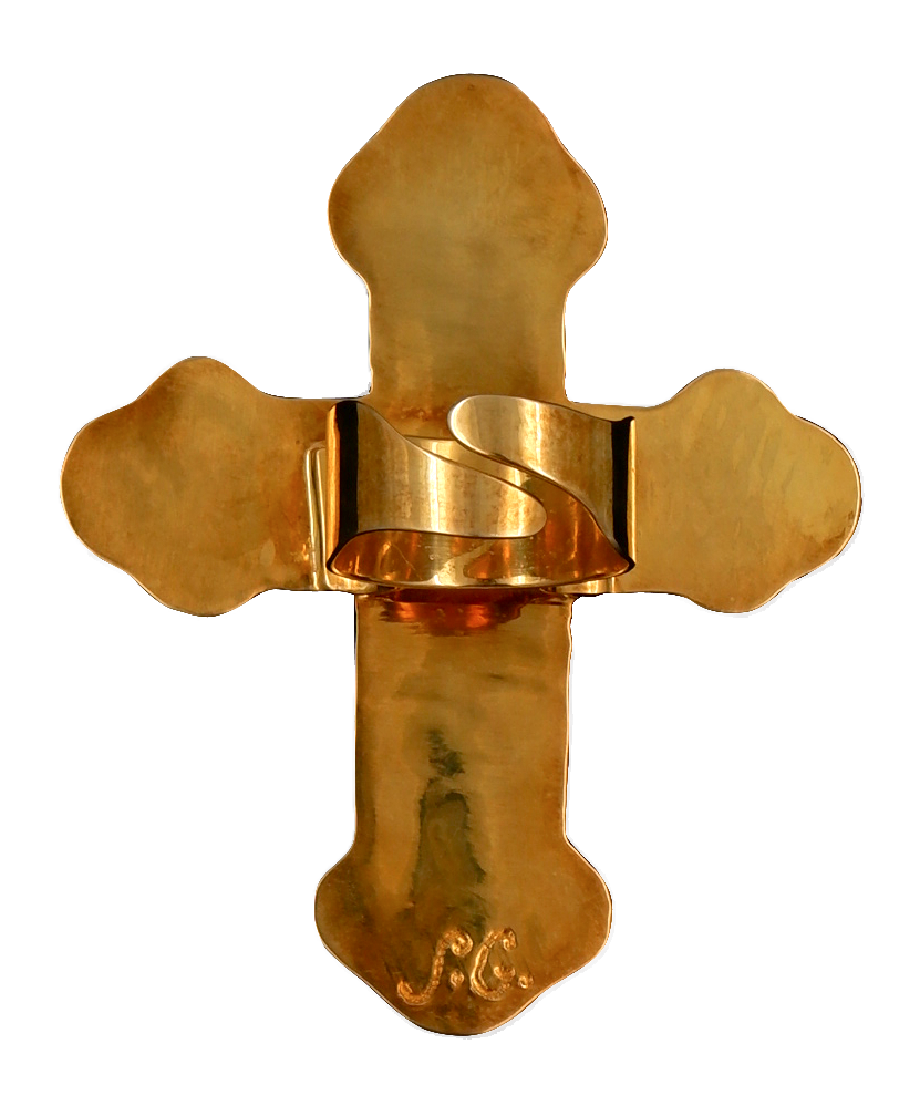 Bright gold metal backing of the cross pendant ring and ring clasp.